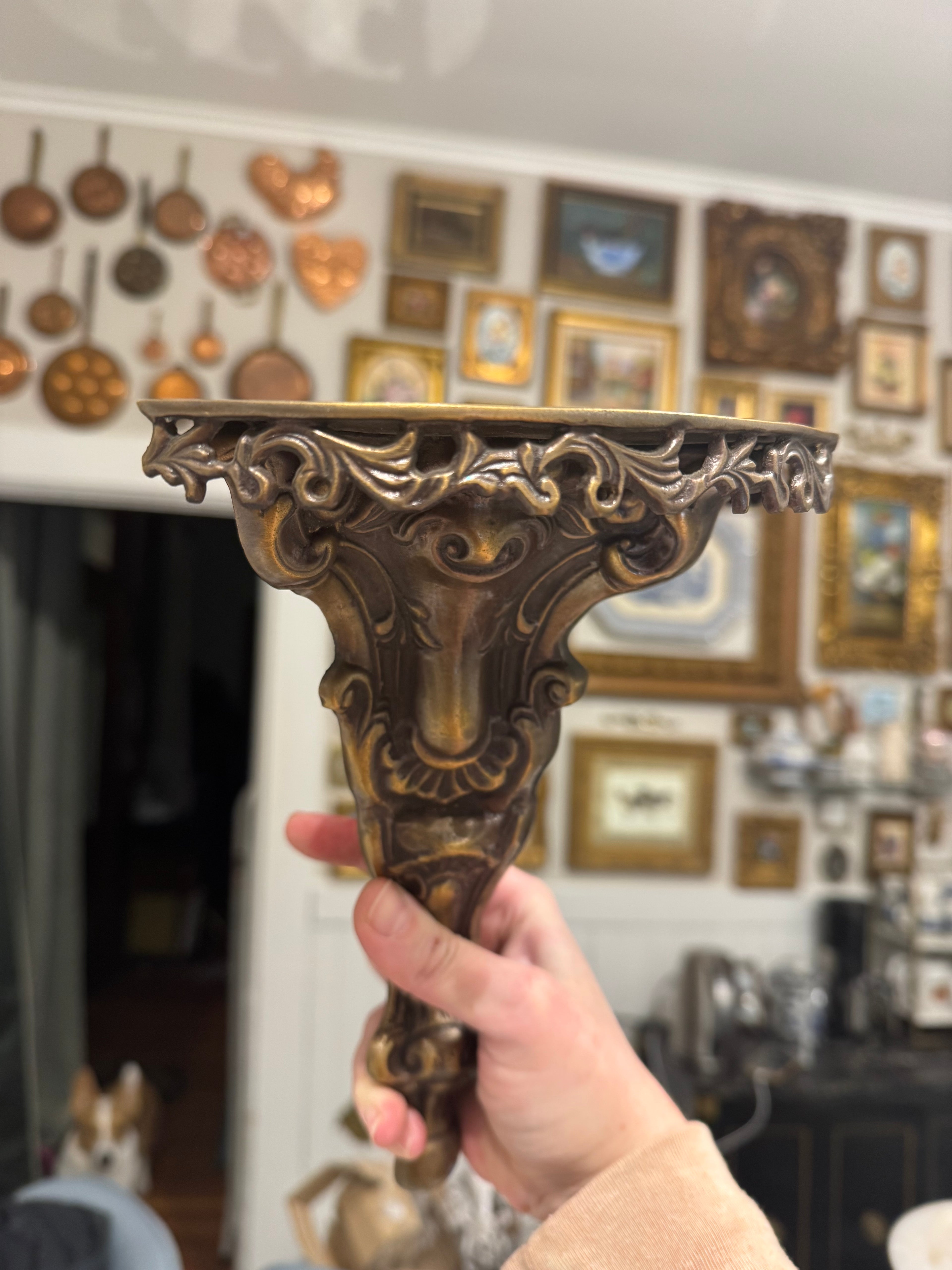 Ornate brass wall shelf