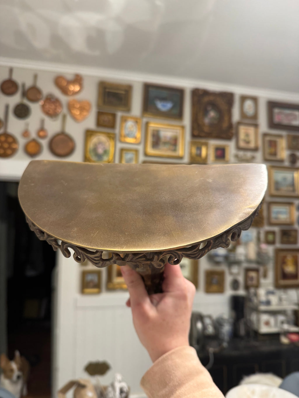 Ornate brass wall shelf