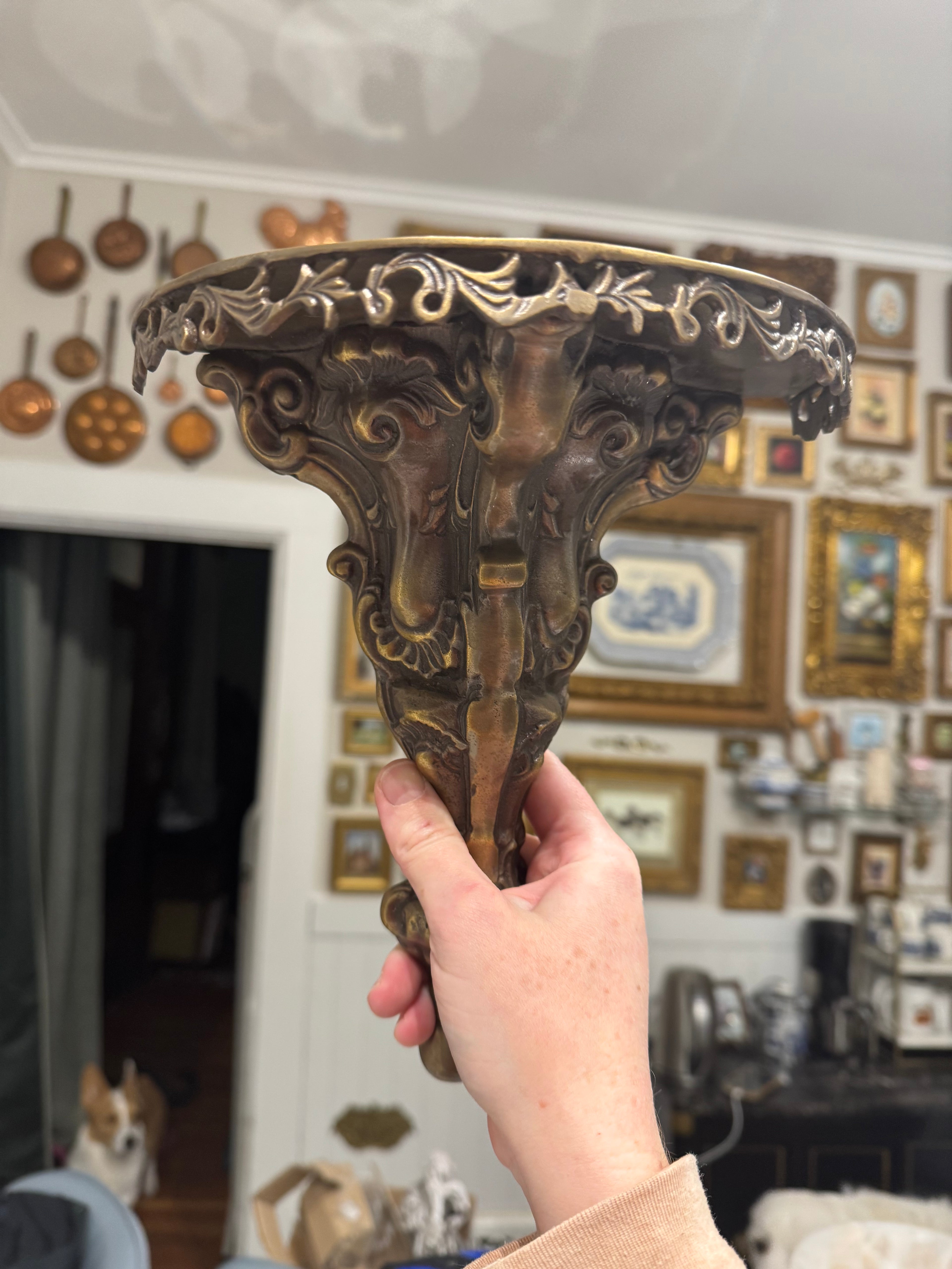 Ornate brass wall shelf